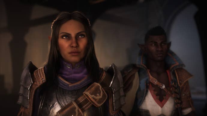 female character in dragon age the veilgard stands to the fore as a male characters stands behind her and to the right