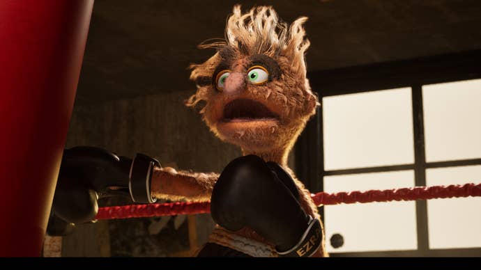 A felt puppet punches a punching container with gloves.