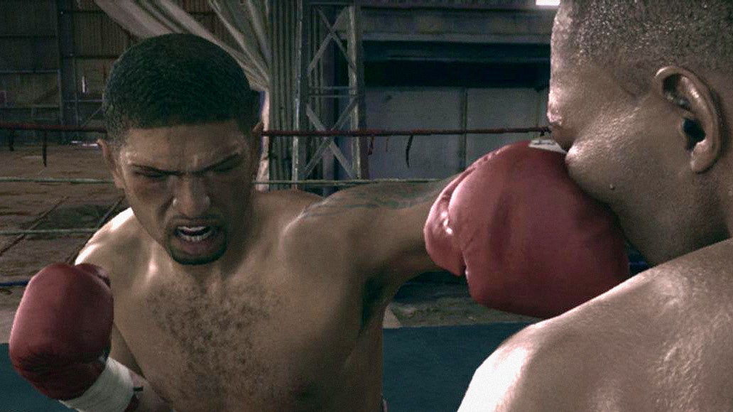 A Fight Night Round 3 screenshot. A close-up image of a man throwing a vicious straight jab that lands on the face of a fighter we see over the shoulder of. Their face crumples.