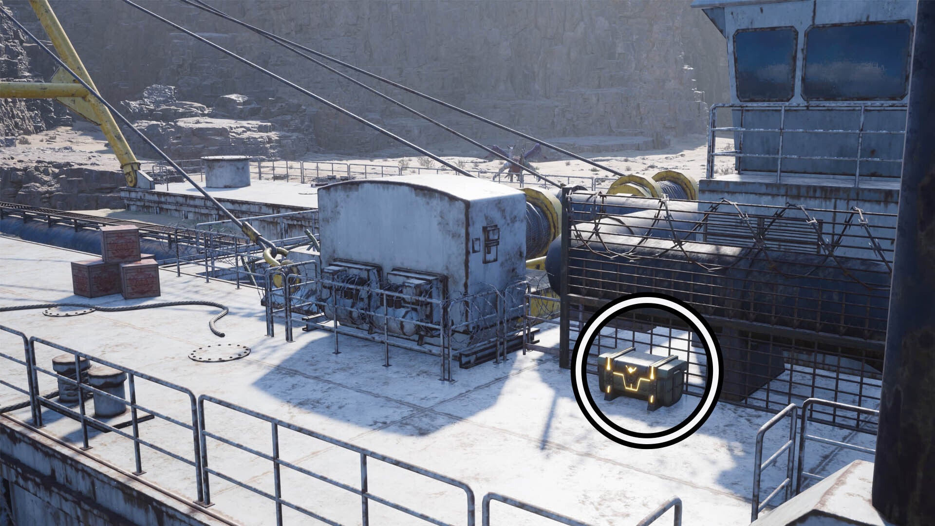 A circle highlights a reward chest sitting beside mechanical parts of a large watermain area.