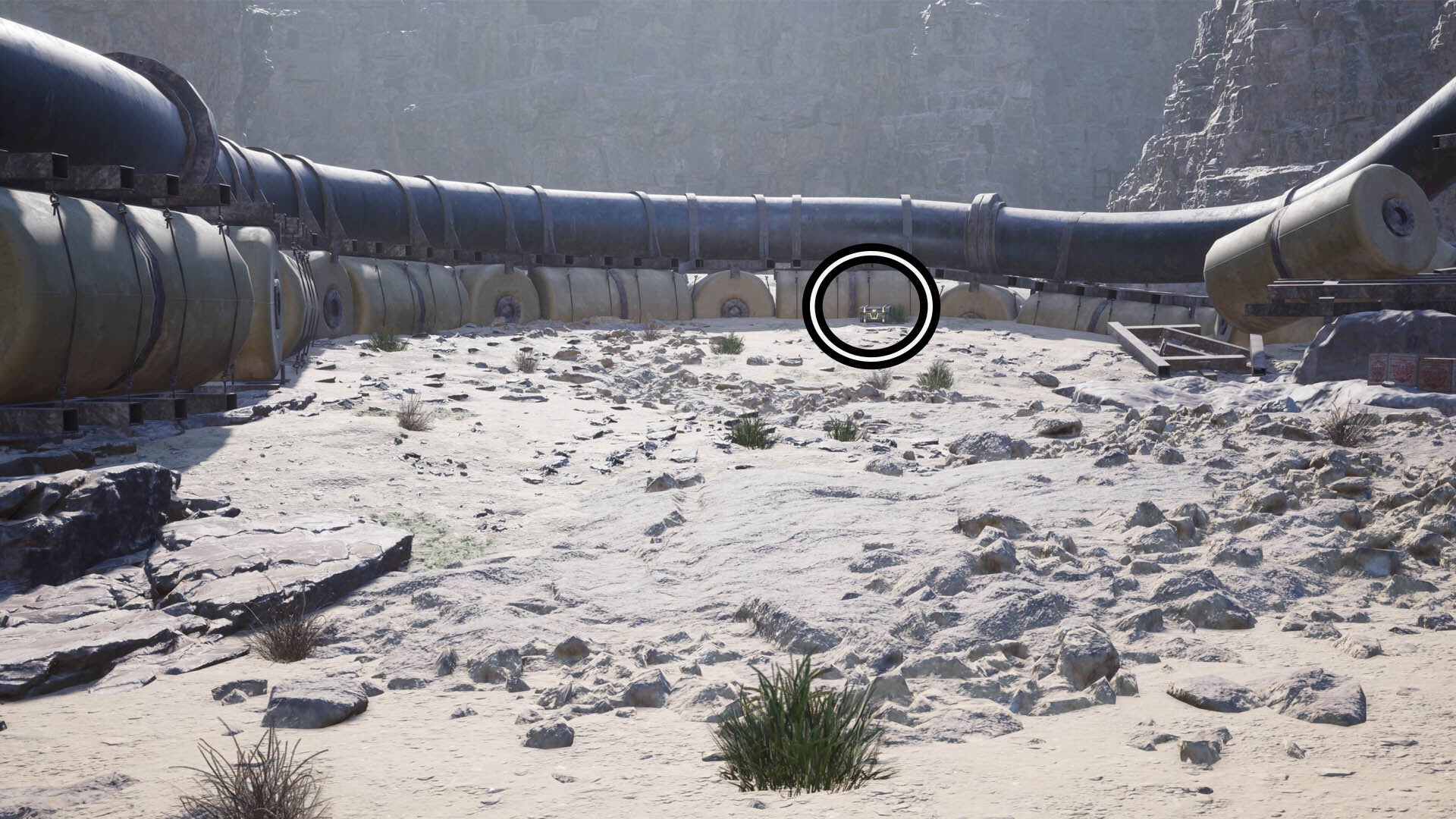 In the distance against a large water pipe, a circle highlights a reward chest.