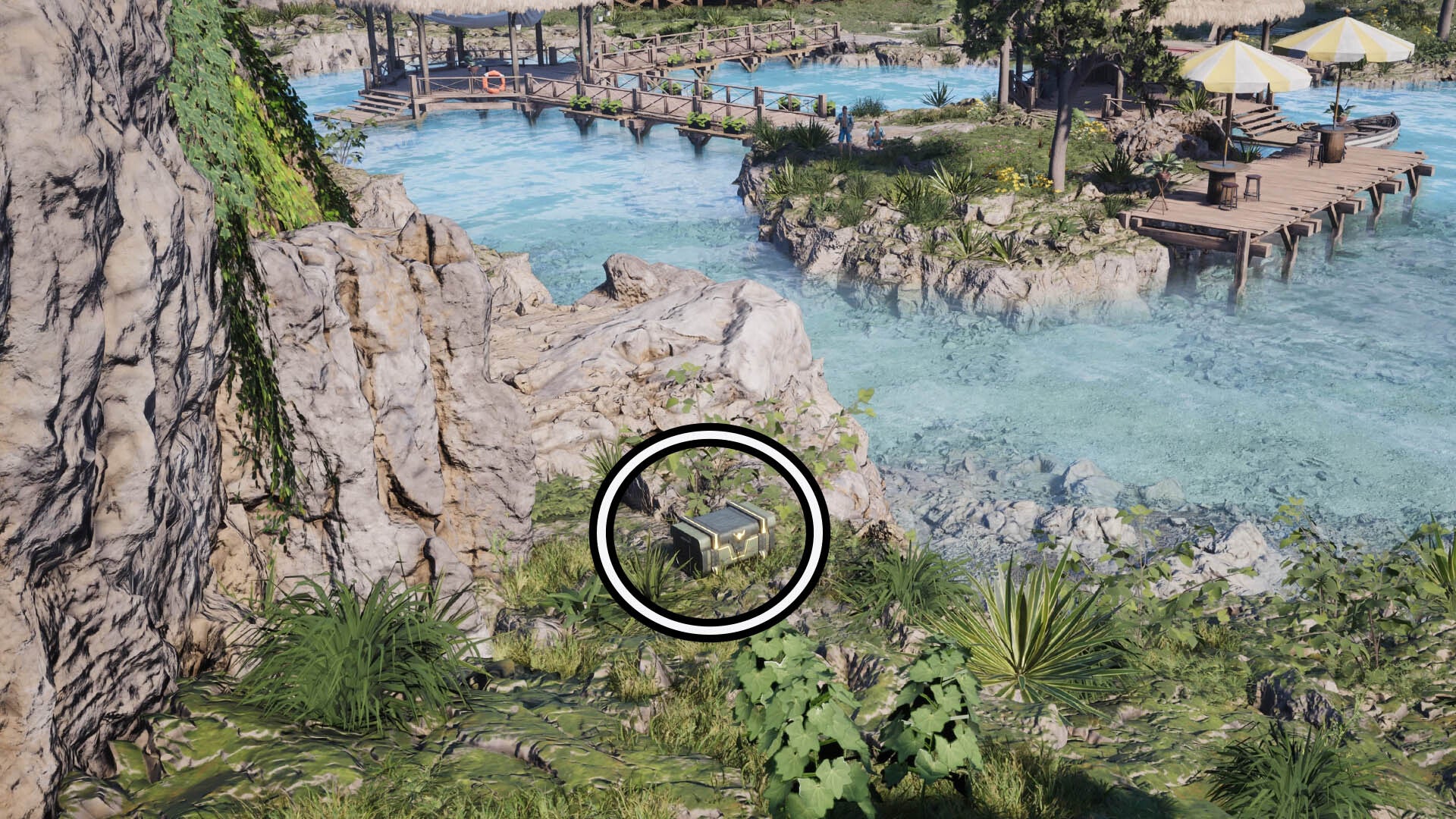 A circle highlights a reward box sitting in some green foliage, a wooden pier with parasols on it sit in the background.