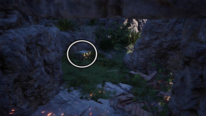 A circle highlights a reward chest on the left side of this picture within a small cave.