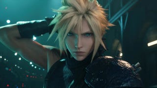Cloud Strife looks into the camera while reaching over his shoulder to grasp his sword.