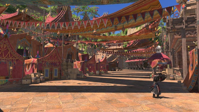 A desert town is decorated with banners and bunting.