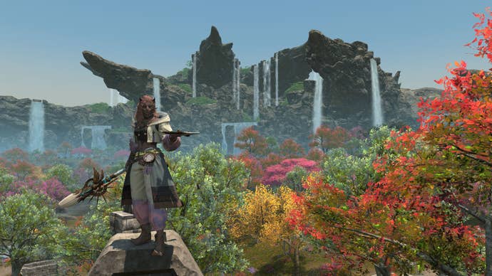 Waterfalls cascade in the background as a player stands in the foreground.
