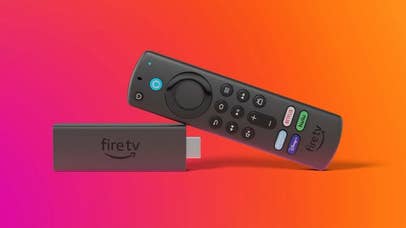 Product shot of Amazon Fire TV remote resting on a Fire TV USB dongle in front of a background fading from magenta to orange