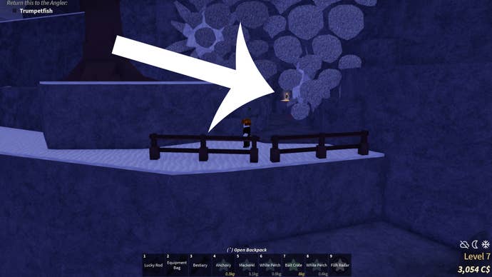 An arrow pointing at a secret cave located on the Ancient Isle in the Roblox game Fisch.