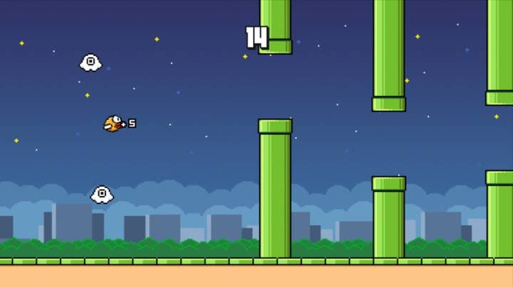 Flappy Bird Family screenshot showing a bird at night approaching an obstacle course of green pipes