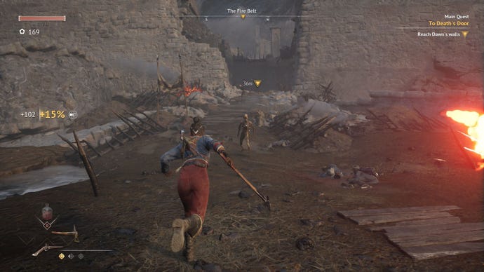 The player runs through mud and rubble to reach a besieged fortress.