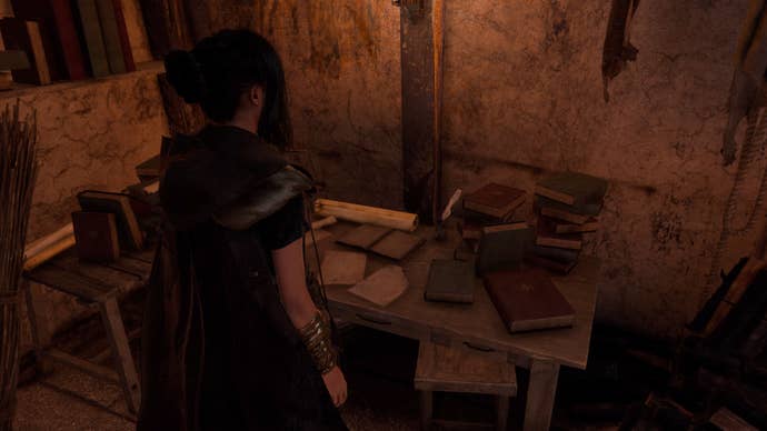 Forspoken, Frey is standing in front of a crafting bench within a Refuge