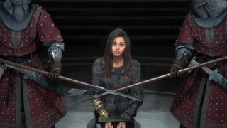Frey, the main character from Forspoken, kneels in front of two guards with sharp spears