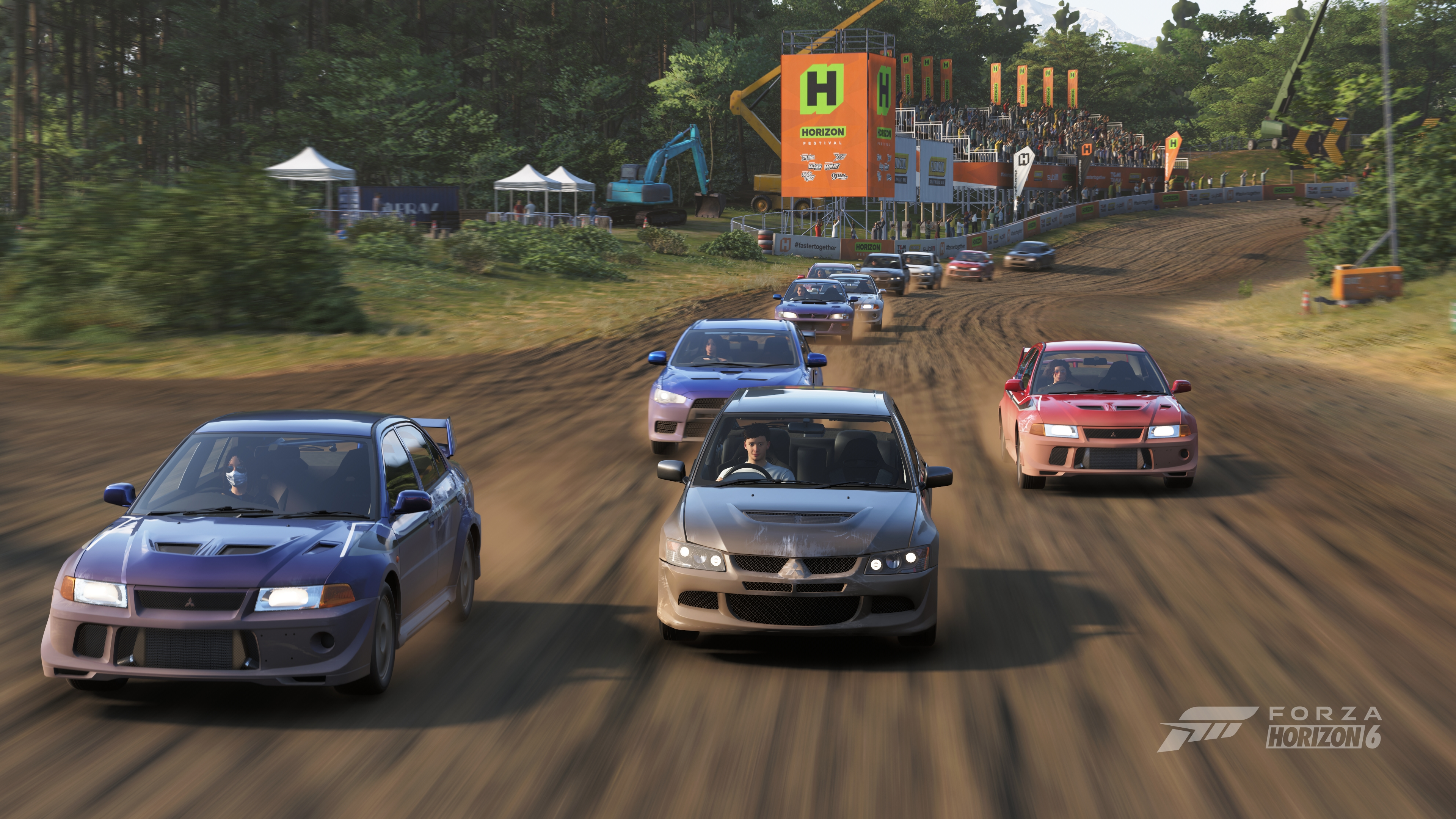 Dirt rally in Forza Horizon 6 with 12 cars taking a corner with banners and crowd infrastructure behind
