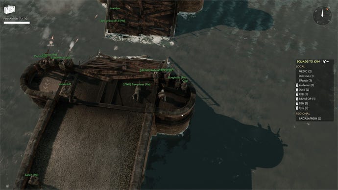 A group of machine gunners fires across a destroyed bridge as the player kneels behind them.