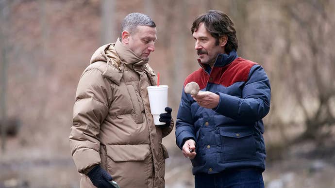 Paul Rudd is showing Tim Robinson a mushroom in the woods in Friendship.
