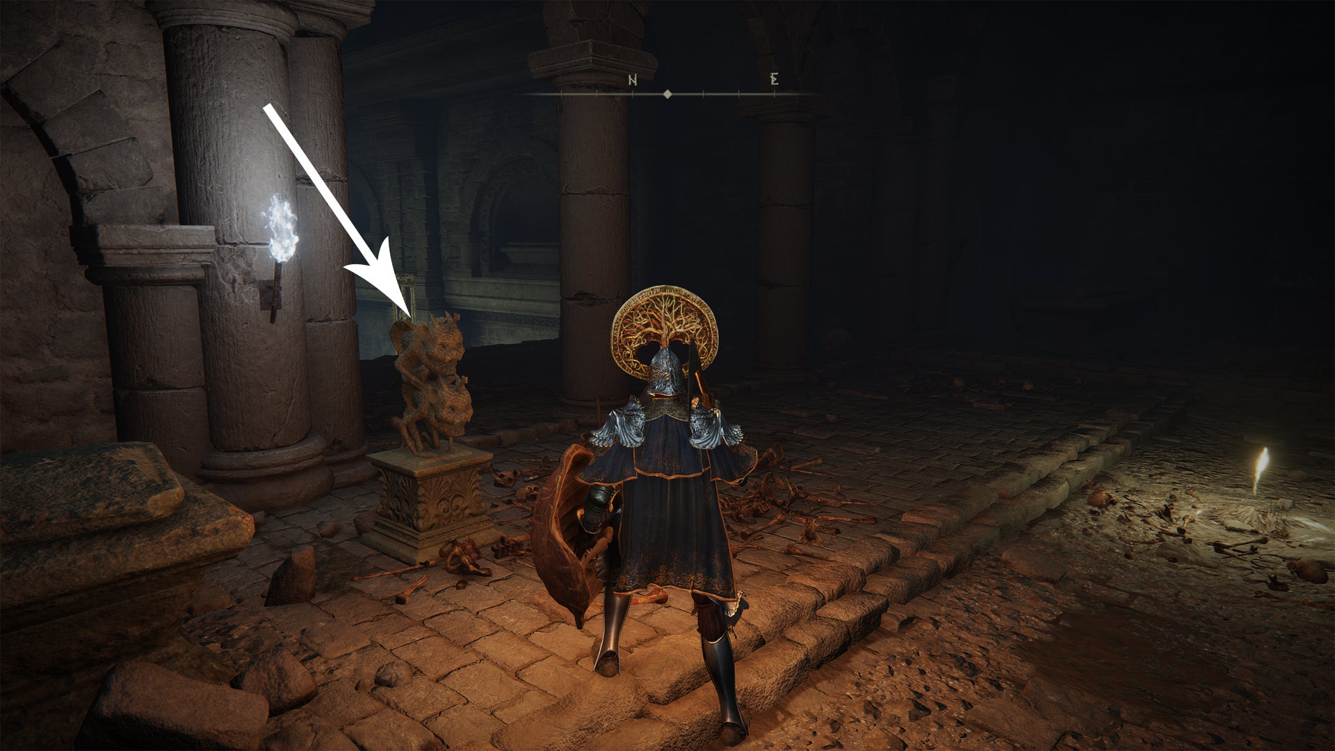 A stone statue in front of the Fringefolk Hero’s Grave in Elden Ring. - 4