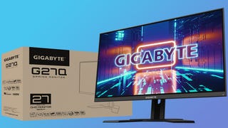 the gigabyte g27q gaming monitor, pictured next to its box