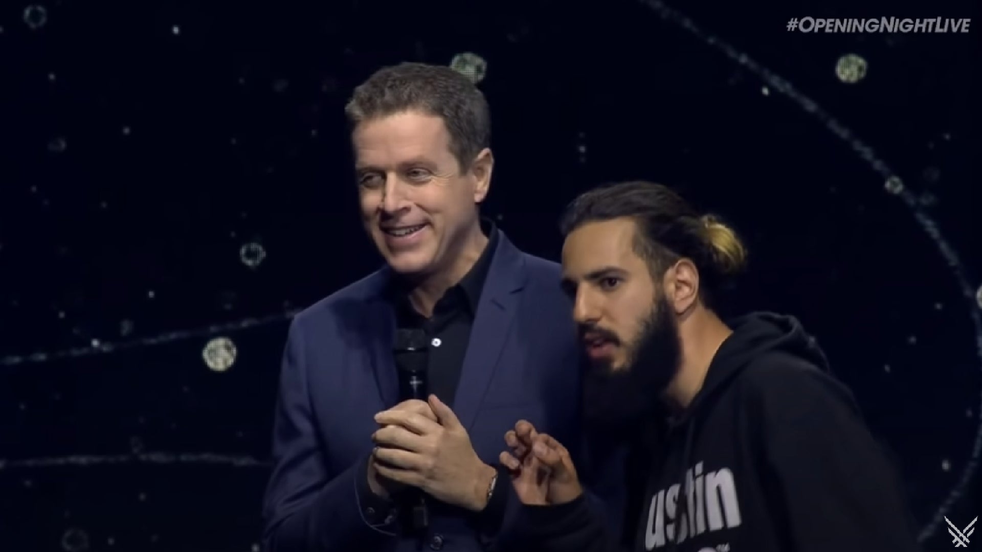 Game Awards host Geoff Keighley alongside a stage crasher. - 3