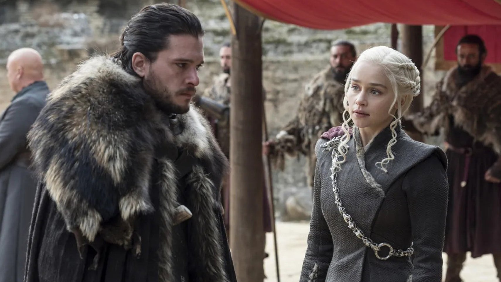 Jon Snow and Daenerys Targaryen stood in an encampment with serious expressions on their faces in Game of Thrones. - 1