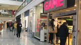 Shoppers queue outside GAME in Brighton.