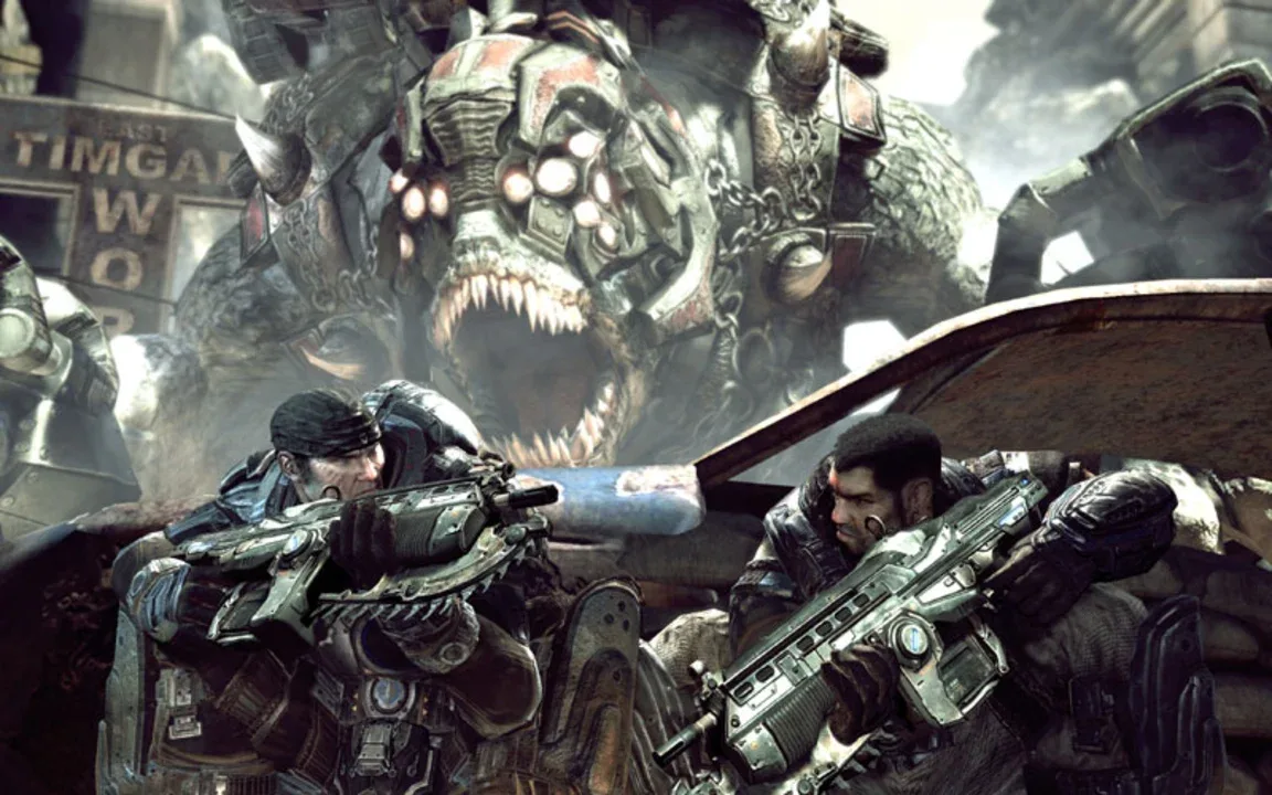 Original Gears of War official screenshot, showing the two main characters crouched behind cover with a giant enemy alien in the background