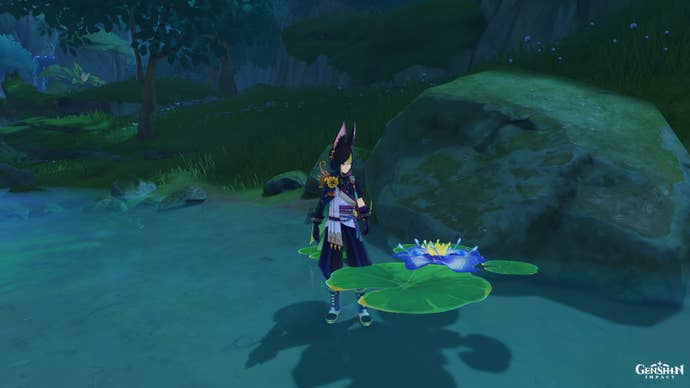Genshin Impact Nilotpala Lotus: A young man wearing green stands in the river near a floating blue flower