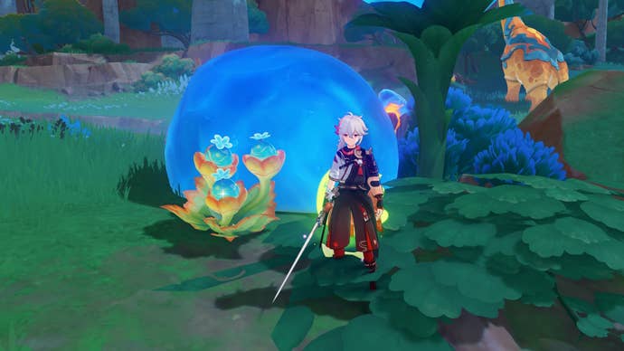 Genshin Impact’s Kazuha standing next to a Quenepa Berry bush in Natlan