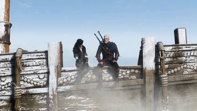 A screenshot from The Witcher 3. Yennefer sits next to Geralt on the side of a frozen ship. She’s turned to look at him.