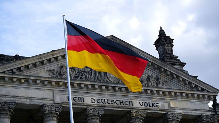 The German flag flying outside the Reichstag