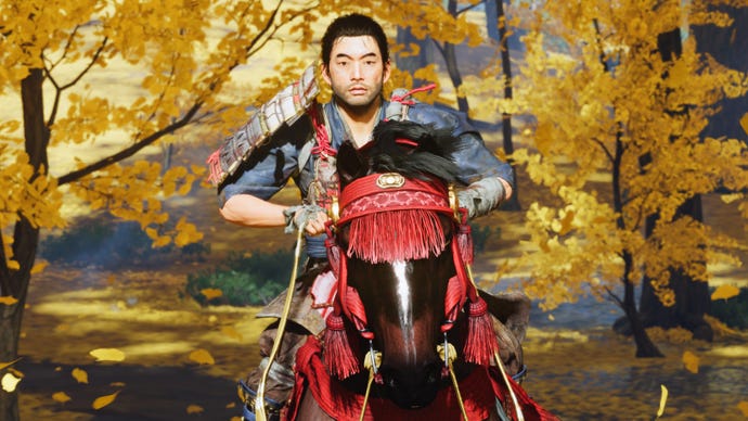 Jin rides a horse through a yellow forest in Ghost of Tsushima's Director's Cut on PC
