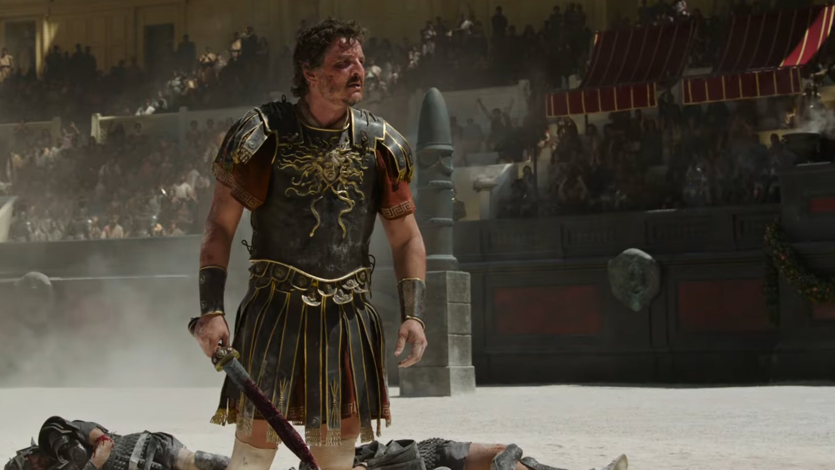 Pedro Pascal stood wearing ancient Roman armour in a colosseum in Gladiator 2. - 1