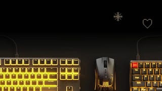 glorious model o mouse and gmmk keyboard pictured on a dark background with winter motifs
