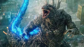 Godzilla is stood roaring, its tail glowing blue, in Godzilla Minus One.
