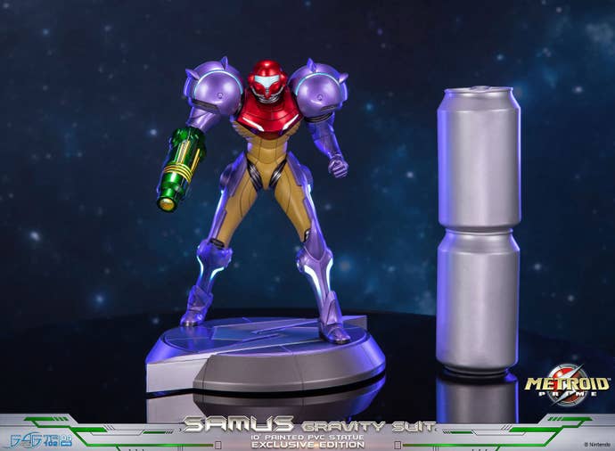 Metroid Prime statue next to two soda cans to give an idea of size