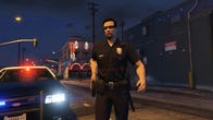 A cop gets out of a police car in GTA 5