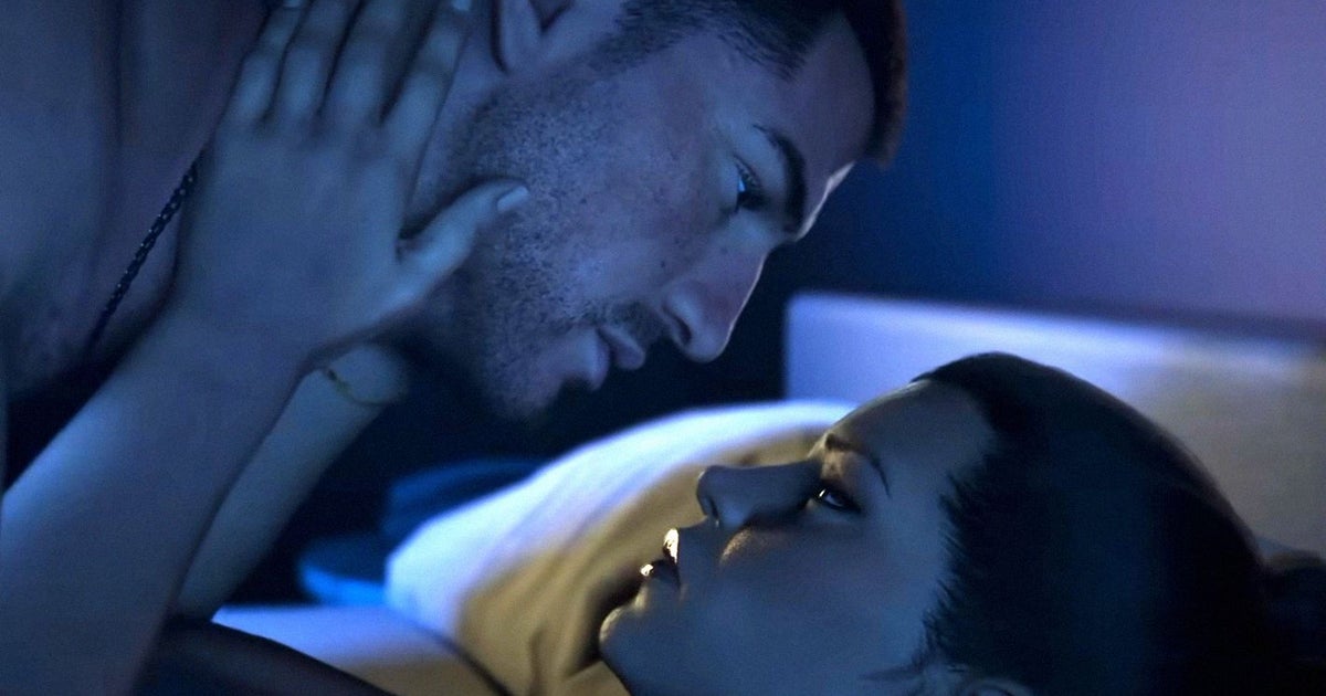 A man and a woman are about to kiss intimately in bed. They are couple Jason and Lucia from Grand Theft Auto 6.