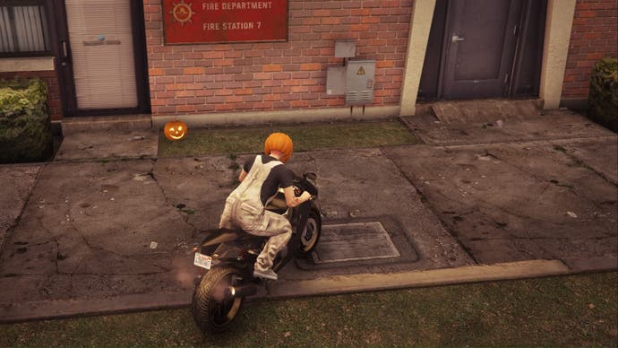 gta online character in pumpkin mask on bike facing jack o lantern on floor by wall