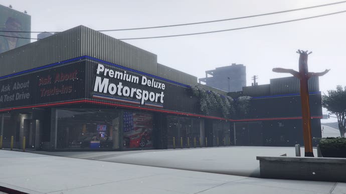 GTA Online, a view of Simeon's Showroom from the road outside.