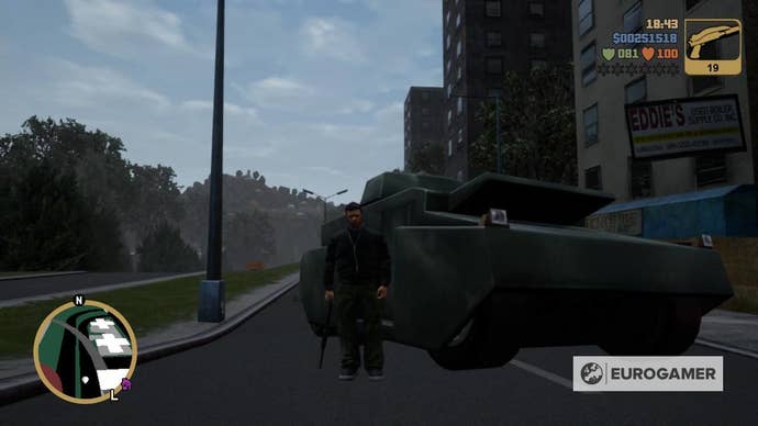 Claude Speed holding a pistol on a street standing next to a Tank in GTA 3