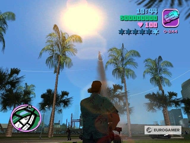 GTA Vice City’s Tommy Vercetti walking through palm trees carrying the Minigun