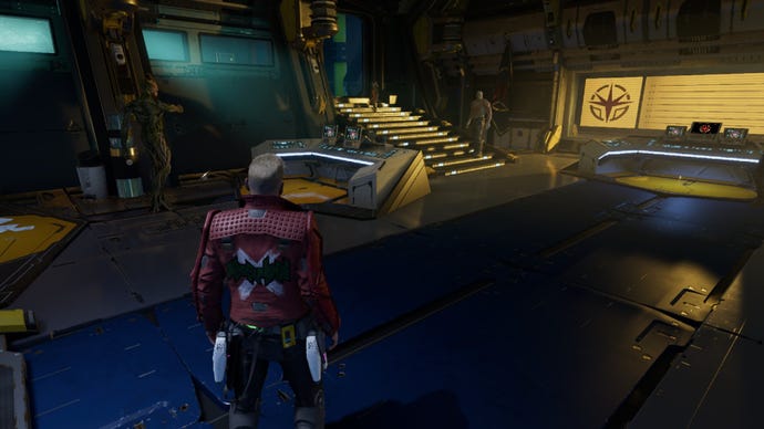 Star-Lord stands near Groot, who is pointing at a collectible