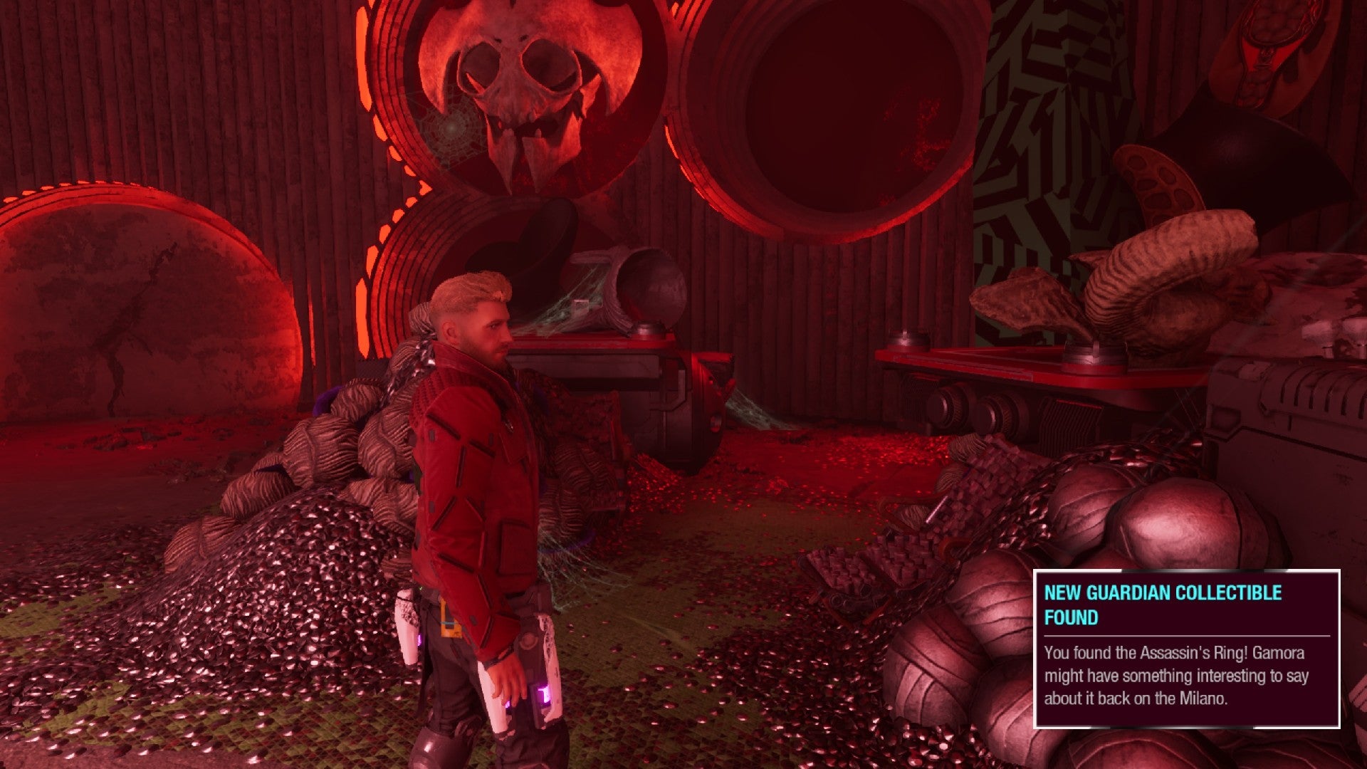 Star-Lord surrounded by treasure in Hellbender&rsquo;s vault, large skull mounted on wall