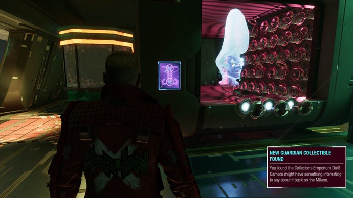 Star-Lord stands near Collector’s hologram head at shop