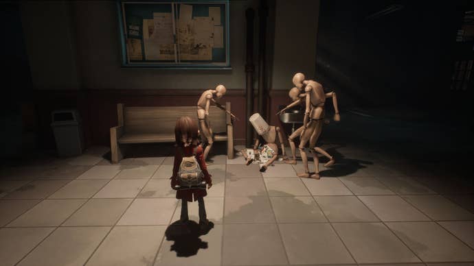 Sally looking at a tableau of mannequins acting out a scene of school bullying in a corridor