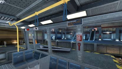 The interior of a train or tram in the opening of Half-Life 1. It's a small carriage with open sides - there are no windows - so you can see the interior of the Black Mesa research facility as Gordan Freeman travels through it. It's a mix of grey metal walls and seats and yellow posts and handrails.