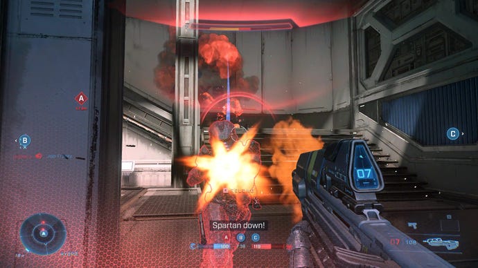 Two Spartans shoot each other at close range with assault rifles in Halo Infinite.