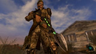 A man holds a gun with a spade attachment on the end of it in Fallout: New Vegas