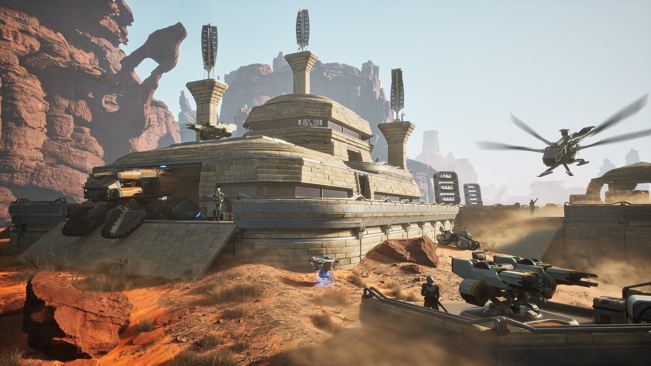 A huge multiple-storey player base in Dune: Awakening wiht tanks and ornithopters - 1