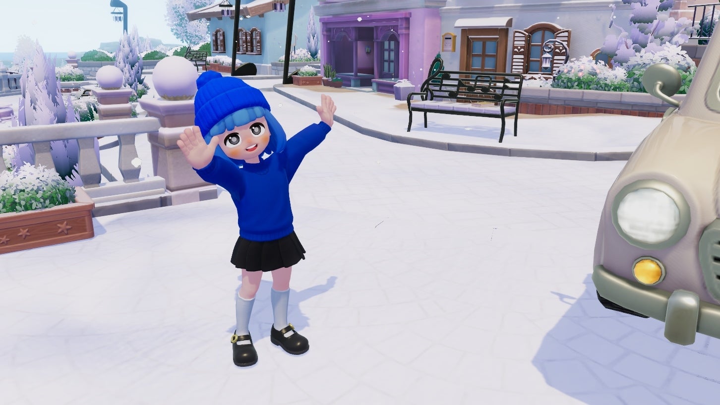 Heartopia's Doris stands on Art Street on a snowy day and waves at the player. - 1