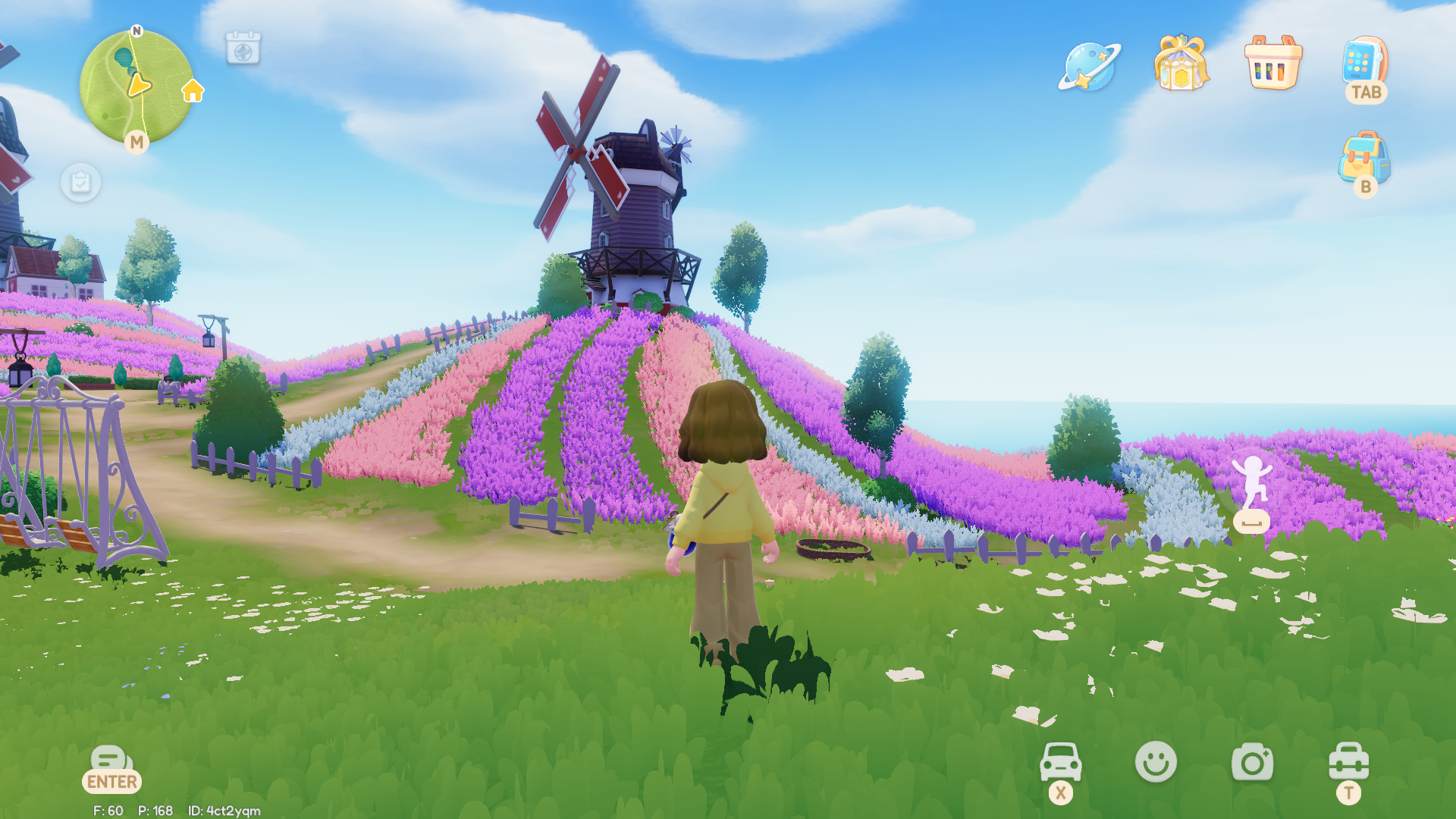 A Heartopia character faces across a pastel multi-coloured flower field leading up a hill towards a windmill. The sea is just visible over the hills. A small basket, the foxes' feeding trough, sits at the foot of the hill. - 6